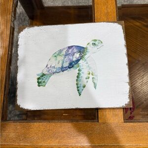 rustic wooden sign featuring a watercolor sea turtle painting